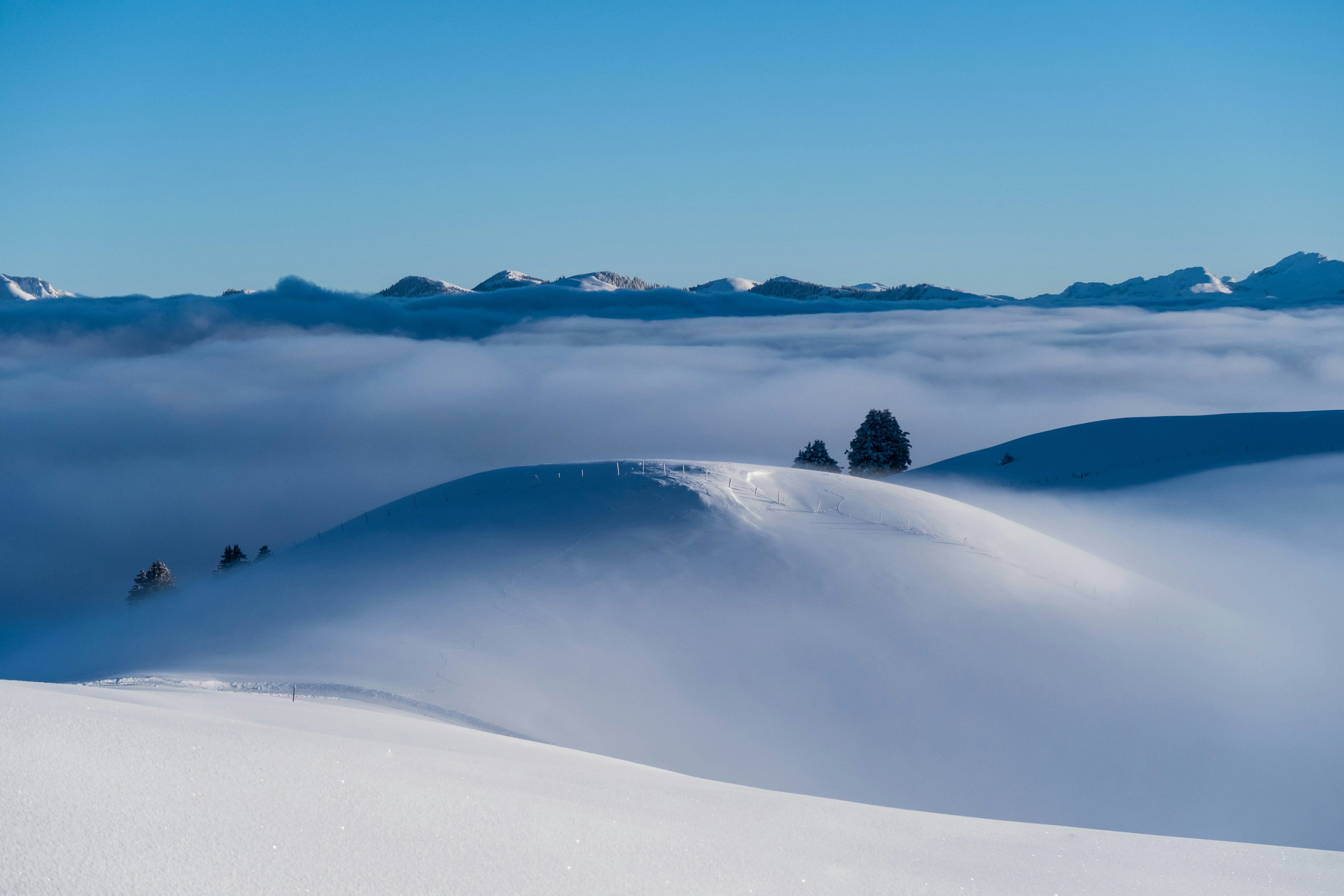 snow covered mountain during daytime